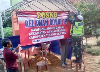 Sertu Ngadino Babinsa Koramil 426-02/Menggala, Bersama Warga dirikan Posko Pantau Covid-19.